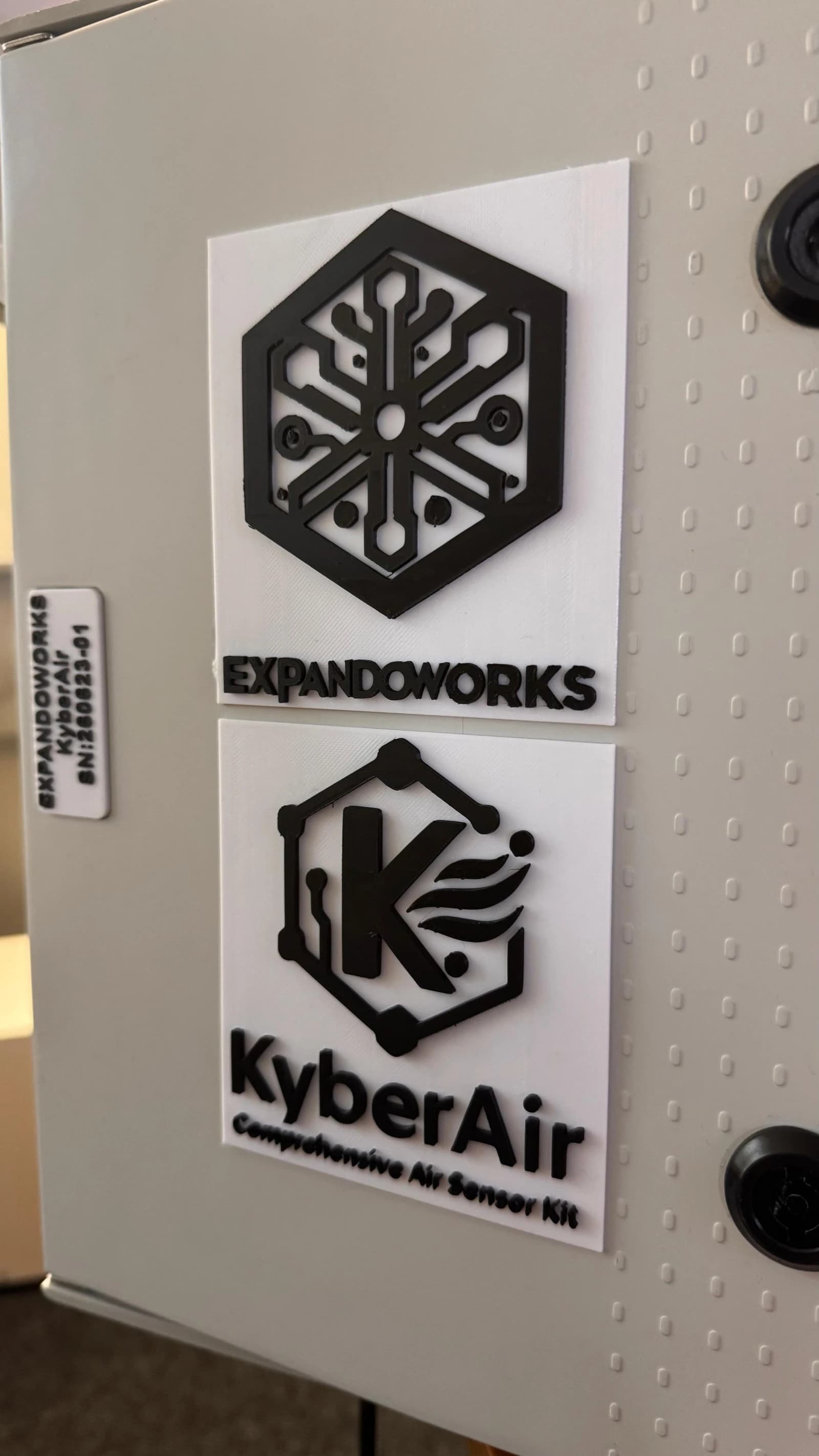 ExpandoWorks and KyberAir logos on a monitoring enclosure