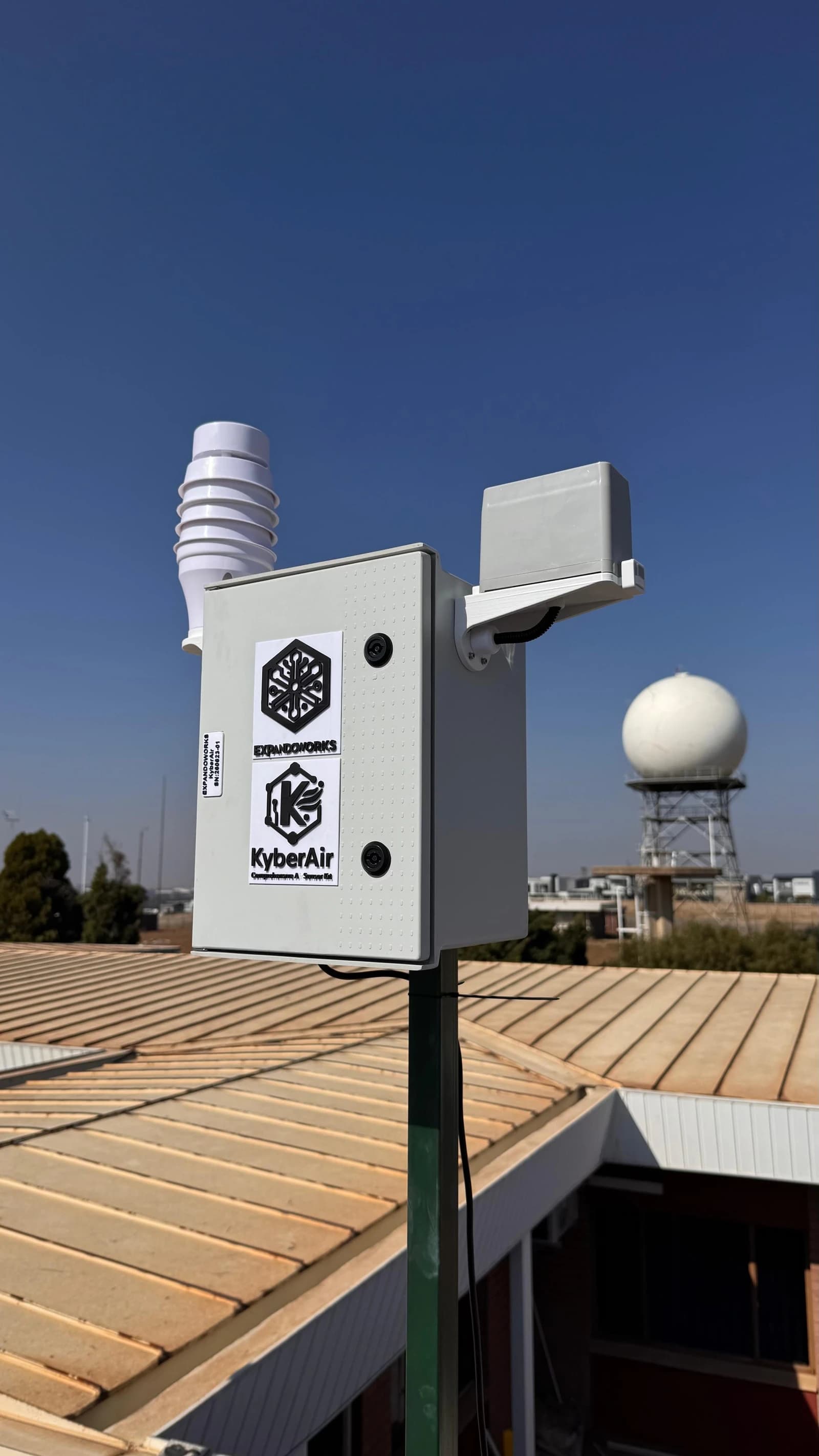 Close view of a KyberAir enclosure mounted outdoors above a roof