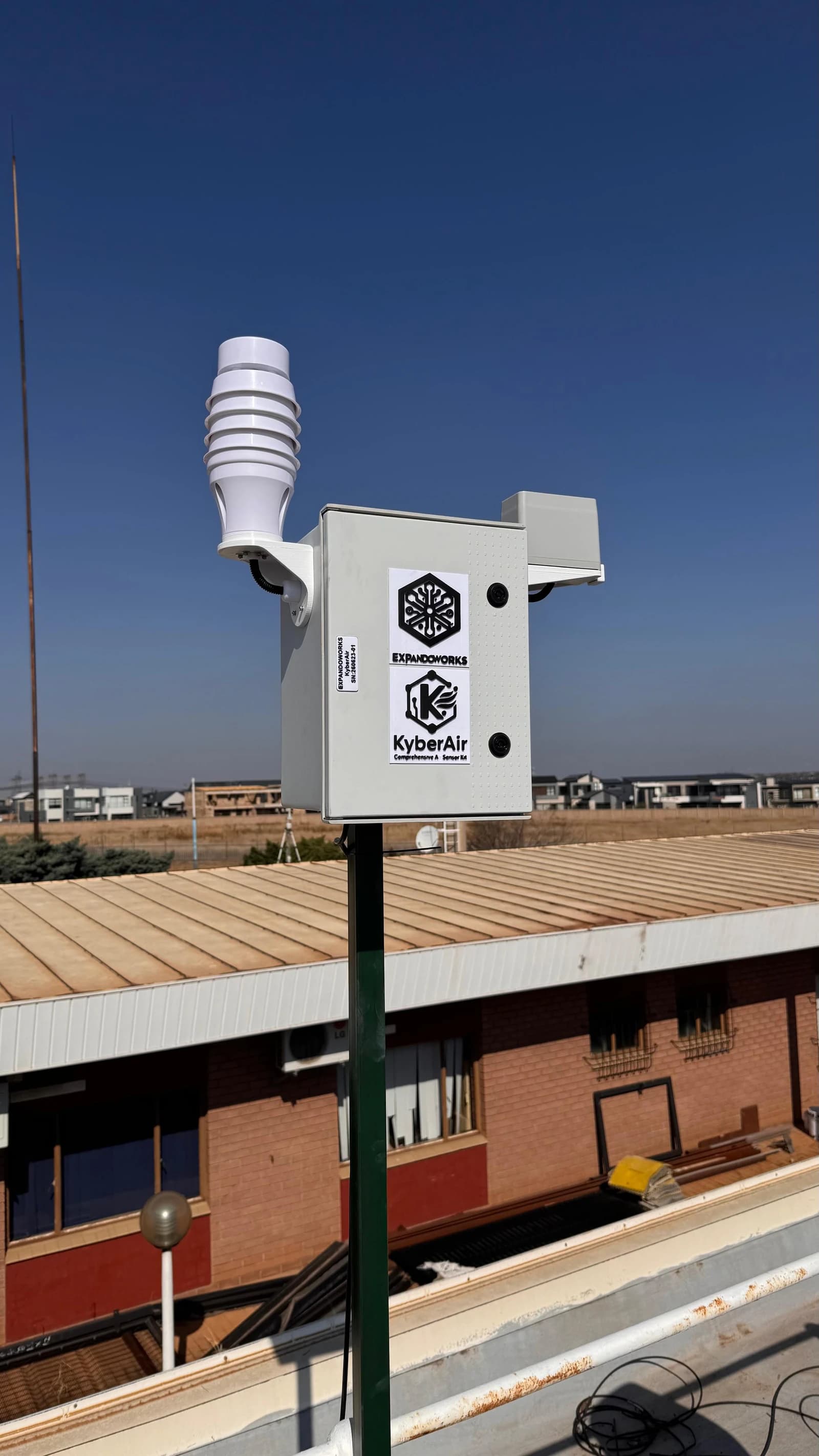 Front view of an installed KyberAir enclosure and sensors